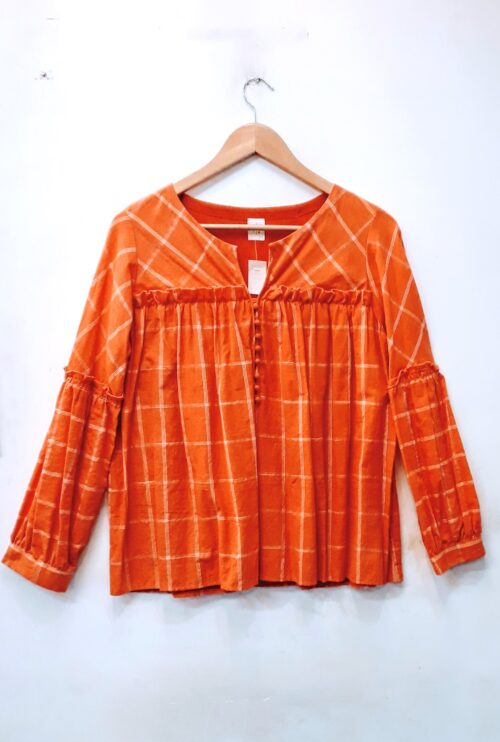 Orange checkered top with gathering and ruffle full sleeves