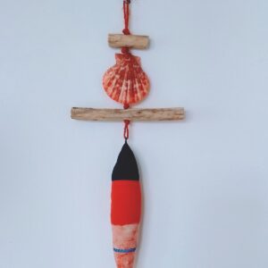 fish soft toy wall hanging with shell and driftwood pieces